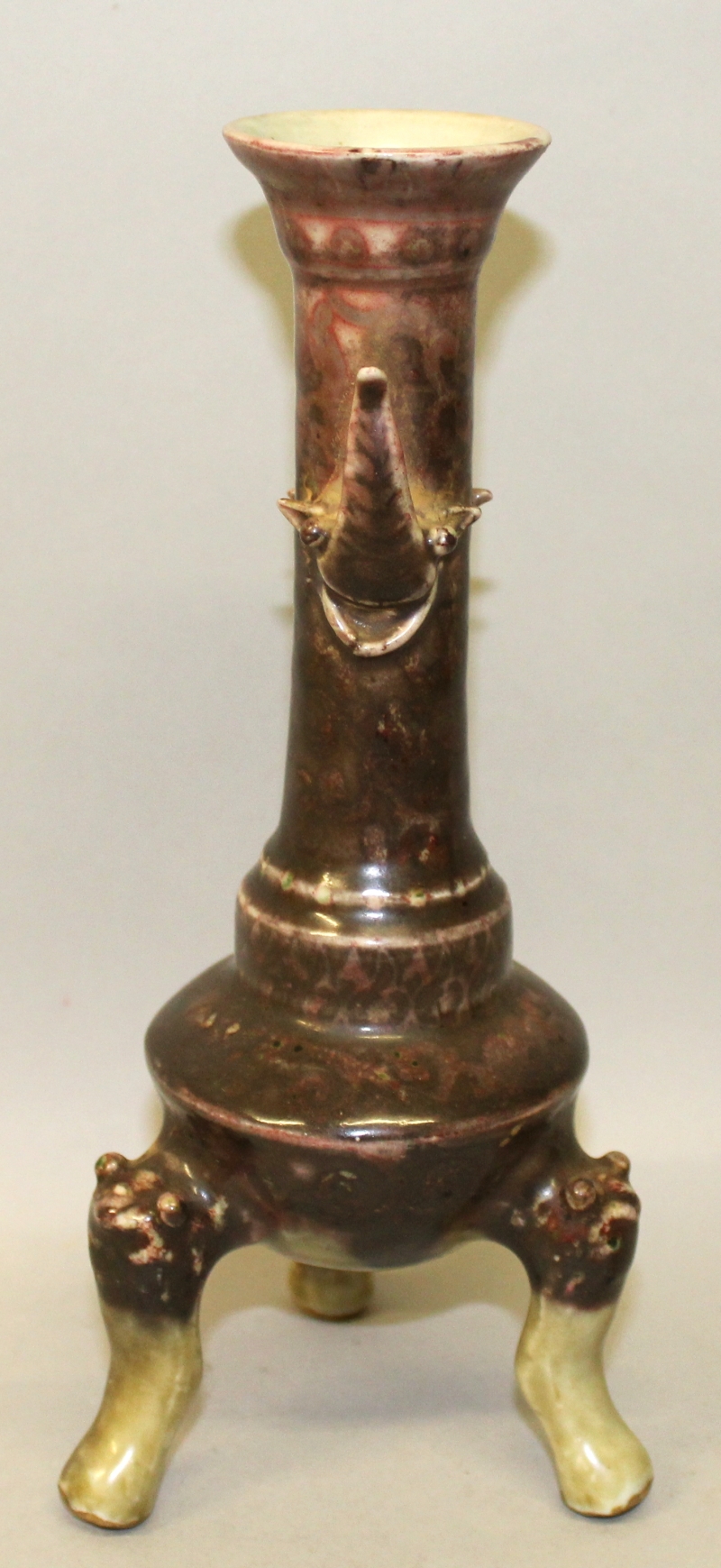 AN UNUSUAL CHINESE PORCELAIN TRIPOD CANDLESTICK, applied with a purple-red glaze and with inverted - Image 3 of 5