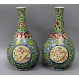 A GOOD PAIR OF CHINESE KANGXI PERIOD FAMILLE VERTE PORCELAIN BOTTLE VASES, circa 1700, each