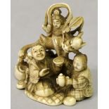 A SIGNED JAPANESE MEIJI PERIOD IVORY OKIMONO OF A FAMILY IN THE COMPANY OF KWANNON & A DRAGON, the