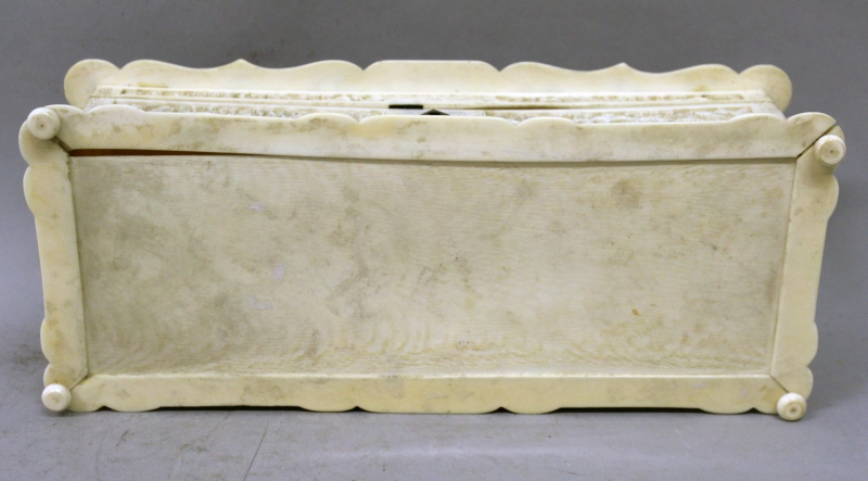 A GOOD 19TH CENTURY CHINESE CANTON IVORY CASKET, the shaped and hinged cover carved in deep relief - Image 9 of 9
