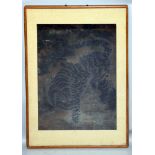 AN 18TH/19TH CENTURY FRAMED KOREAN PAINTING ON PAPER, depicting a tiger in a landscape of rockwork