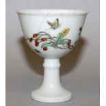 A CHINESE FAMILLE VERTE PORCELAIN STEM CUP, the sides decorated with butterflies and an extended