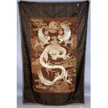 A LARGE ORIENTAL EMBROIDERED WALL HANGING, depicting two phoenix above a sinuous dragon, within a