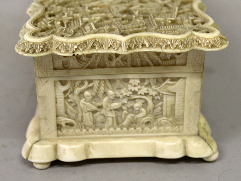 A GOOD 19TH CENTURY CHINESE CANTON IVORY CASKET, the shaped and hinged cover carved in deep relief - Image 4 of 9