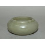 A SMALL 19TH CENTURY JADE BRUSHWASHER, of mottled brownish celadon tone. 2.1is wide at widest