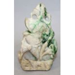 AN EARLY 20TH CENTURY CHINESE JADE MODEL OF A LEAPING CARP, leaping from waves amidst lotus, the