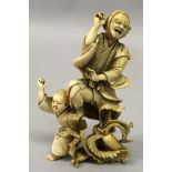 A JAPANESE MEIJI PERIOD IVORY OKIMONO OF A MAN & A BOY, dancing before a group of giant