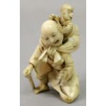 A JAPANESE MEIJI PERIOD IVORY OKIMONO OF A MAN & A MONKEY, the hair of the kneeling man being pulled