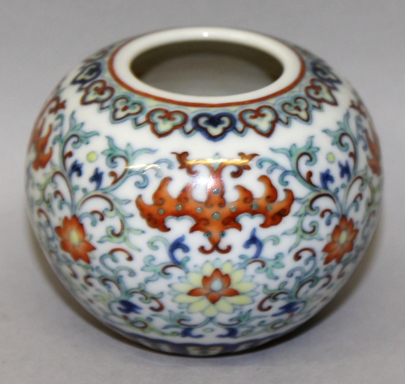 A SMALL CHINESE DOUCAI PORCELAIN WATER POT, decorated with bats above scrolling lotus, the base with