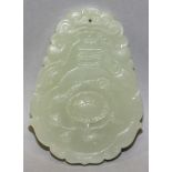 A CHINESE SHAPED CELADON JADE PENDANT, decorated to one side with a flowerhead, the reverse side