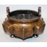 A LARGE GOOD QUALITY CHINESE BRONZE TRIPOD CENSER, weighing 3.07Kg, with double upright handles