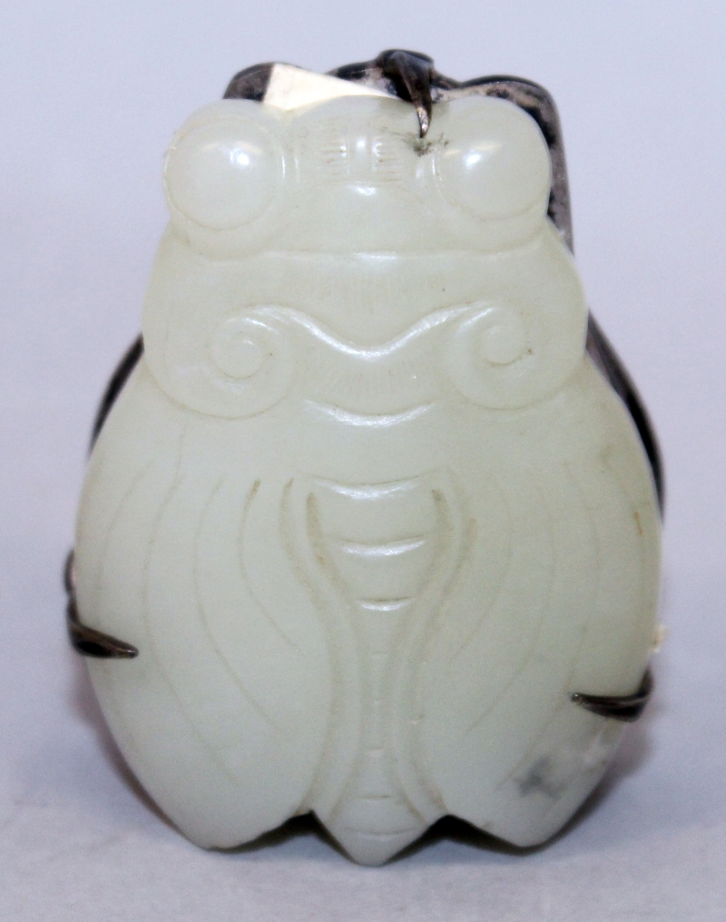 A GOOD 19TH/20TH CENTURY CHINESE CELADON JADE MODEL OF A MOTH, mounted on a silver-metal clip, the