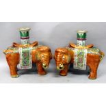 A GOOD LARGE PAIR OF 19TH CENTURY CANTON ELEPHANT CANDLESTICKS, each standing four square with