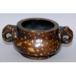 A GOOD 19TH CENTURY CHINESE GOLD SPLASHED BRONZE CENSER, weighing 905gm, the sides cast with