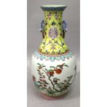 A GOOD QUALITY CHINESE FAMILLE ROSE PORCELAIN VASE, the sides decorated with garden foliage