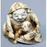 A JAPANESE MEIJI PERIOD IVORY NETSUKE OF DAIKOKU, in the company of a small boy, the details