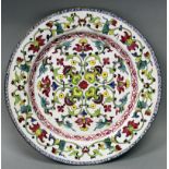AN UNUSUAL 18TH CENTURY CHINESE QIANLONG PERIOD CANTON ENAMEL DISH, decorated with formal foliate