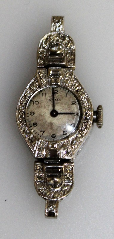 AN ART DECO DIAMOND SET COCKTAIL WATCH.