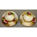 A ROYAL WORCESTER GOOD PAIR OF CUPS AND SAUCERS painted with Hadley style rose, painted and signed