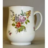 AN 18TH CENTURY CHELSEA MUG painted in Meissen style with flowers, red anchor mark.