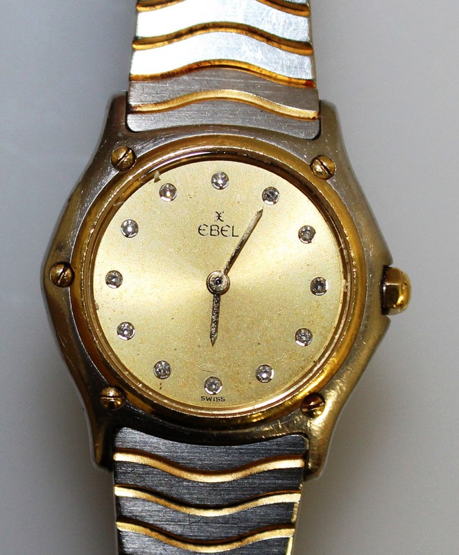 A LADIES EBEL DIAMOND SET DIAL WRISTWATCH.