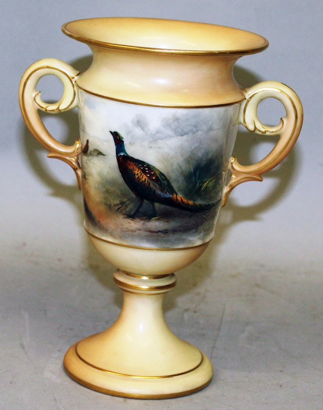 A LATE 19TH CENTURY GRAINGERS WORCESTER TWO HANDLED VASE, painted with a brace of pheasants by