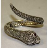 A MARCASITE AND SILVER SNAKE BRACELET with inset watch.