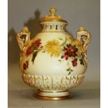 A ROYAL WORCESTER BLUSH IVORY TWO HANDLED VASE AND COVER, painted with flowers, date code for 1906.