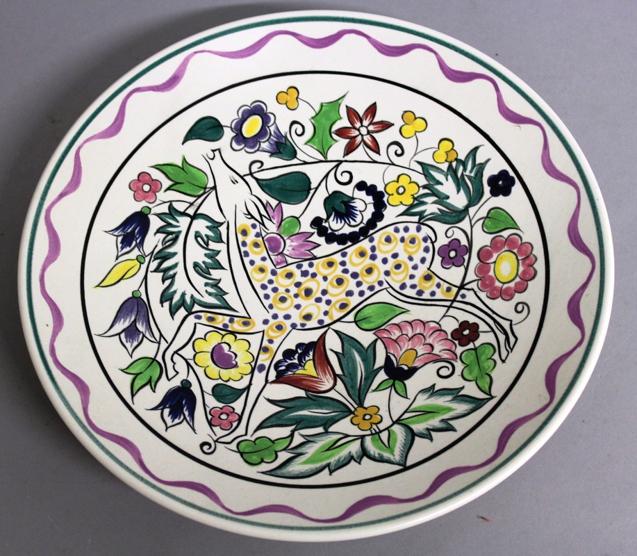 A POOLE POTTERY CIRCULAR DISH by N. BLACKMORE, colourful deer. Signed on reverse.  10.25ins