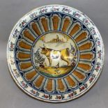 AN 18TH CENTURY MAJOLICA BOWL painted with a bull.