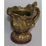 A SUPERB CLASSICAL GILT BRONZE EWER on a circular marble base. 5ins high.