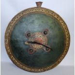 AN EARLY INDIAN PAINTED CIRCULAR LEATHER SHIELD. 22ins diameter.