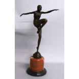 AN ART DECO STYLE BRONZE FIGURE OF A DANCER, on a circular marble base. 1ft 10ins high.