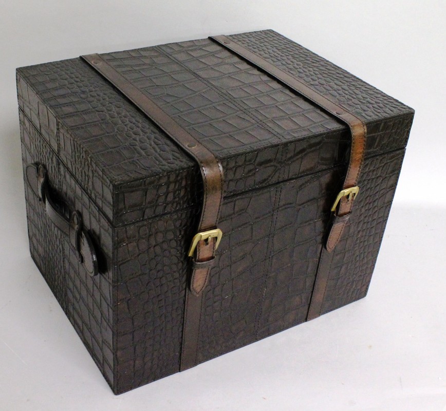 A FAUX CROCODILE LEATHER SMALL TRAVELLING TRUNK, with buckled straps and carrying handles. 1ft
