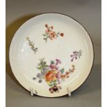 AN 18TH CENTURY CHELSEA SAUCER painted with Meissen style flowers, red anchor mark.