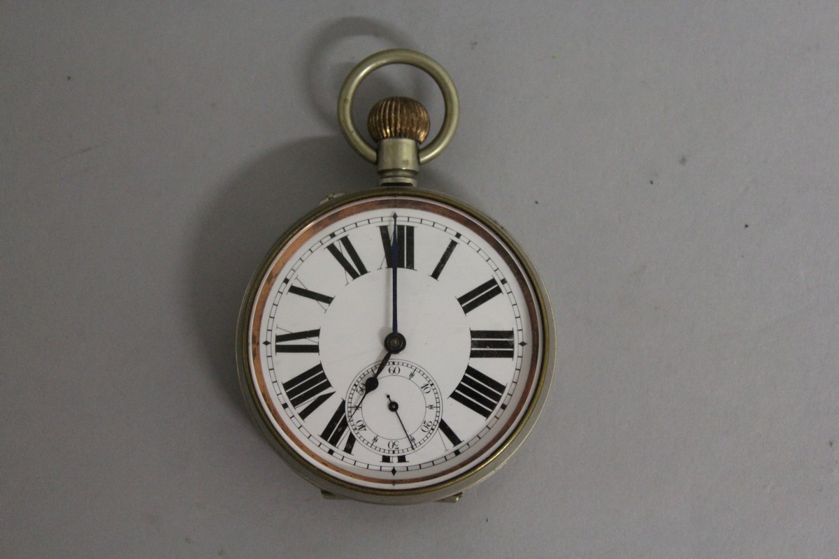 A GENTLEMAN'S LARGE ARGENTAN POCKET WATCH, 6cm diameter.