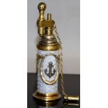 A "FABERGE" SILVER AND ENAMEL DRUM SHAPED LIGHTER with enamel, mounted with an anchor and crest in