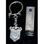 A SILVER LIPSTICK HOLDER and a SILVER KEY RING.