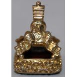 A GEORGIAN GOLD MOUNTED FOB SEAL, the rounded rectangular armorial incised cornelian intaglio,