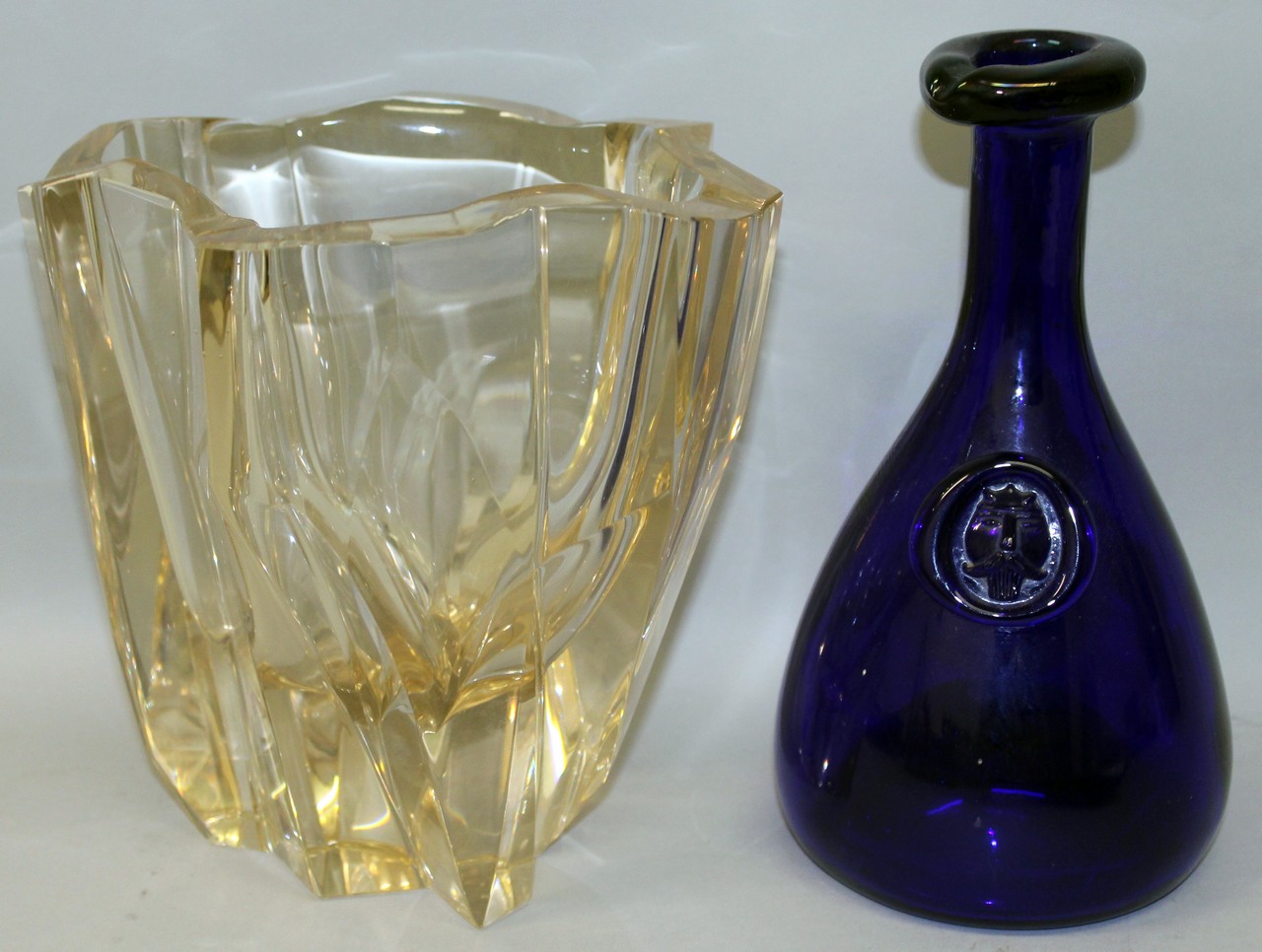 A HEAVY CUT GLASS VASE AND BLUE GLASS CARAFE (2).