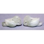 A SMALL PAIR OF CHINESE CELADON JADE PENDANTS, each in the form of a Mandarin duck, each 1.4in