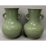 A PAIR OF 19TH/20TH CENTURY CHINESE CELADON PORCELAIN VASES, each decorated beneath the glaze with