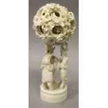 ANOTHER EARLY 20TH CENTURY CHINESE CARVED IVORY CONCENTRIC BALL ON STAND, the stand carved in the