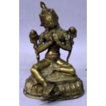 A NORTH INDIAN OR NEPALESE BRONZE FIGURE OF TARA, seated on a lotus base, 6.75in high.