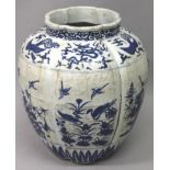 A LARGE CHINESE MING STYLE BLUE & WHITE PORCELAIN JAR, the lobed sides decorated with scenes of