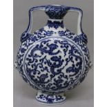 A CHINESE MING STYLE BLUE & WHITE PORCELAIN FLASK, each domed side decorated with stylised