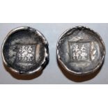 TWO CHINESE SILVER-METAL INGOTS, weighing approx. 60gms each, each with impressed character marks,