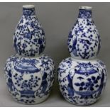 A PAIR OF 19TH CENTURY CHINESE BLUE & WHITE DOUBLE GOURD PORCELAIN VASES, each decorated with