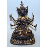 A 19TH CENTURY SINO-TIBETAN GOLD LACQUERED BRONZE FIGURE OF USNISAVIJAYA, seated in dhyanasana on