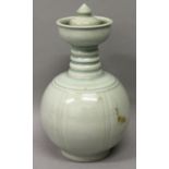 A CHINESE SONG STYLE CELADON PORCELAIN EWER & COVER, the sides with vertical ribbing, the waisted